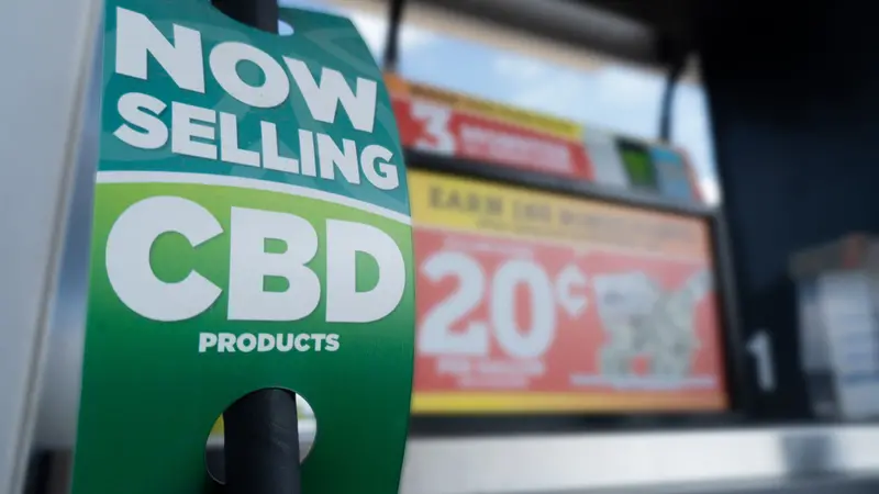 Closeup of CBD product sign at a gas station Closeup of CBD product sign at a gas station