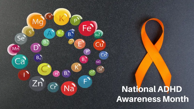 Orange ribbon on black background with Micro and macro elements and vitamins in a circular scheme
