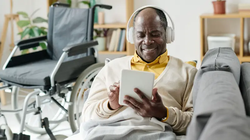 Man listening to music on tablet 