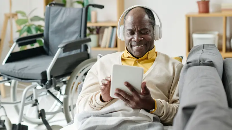 Man listening to music on tablet Man listening to music on tablet