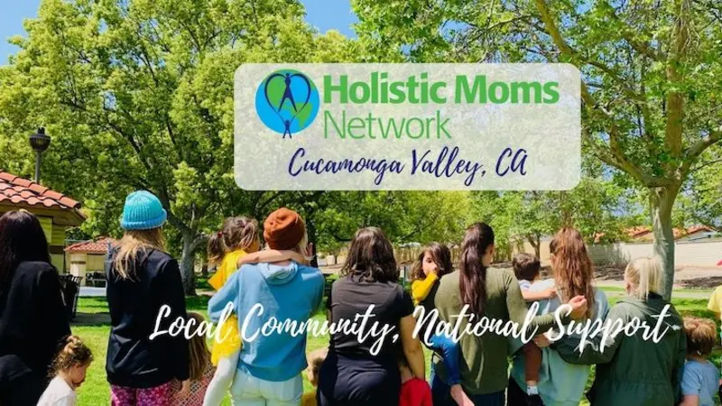 Cucamonga Valley, CA Chapter Gathering Green Trees at the top, with women standing in a line holding their babies. Title of Chapter: Holistic Moms Network Cucamonga Valley, CA. Local Community, National Support