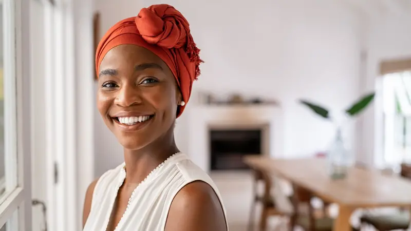 Portrait of a beautiful african woman smiling while looking at camera.