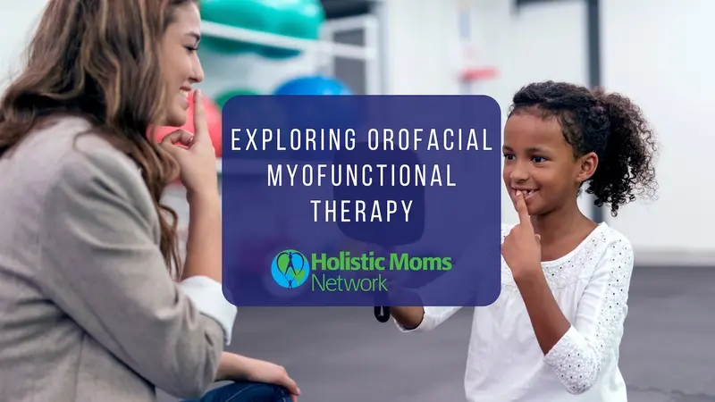 Woman facing a child while holding a finger to their mouths. The title Exploring Orofacial Myofunctional Therapy is in white text with a blue box background. The subtitle beneath is Holistic Moms Network 