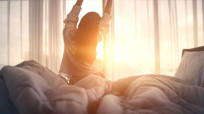 Woman streching in morning light Woman streching in morning light