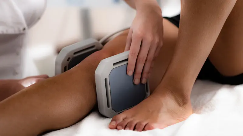 Magnet therapy. Magnets used in physical therapy, placed to patient's knee. Magnet therapy. Magnets used in physical therapy, placed to patient's knee.