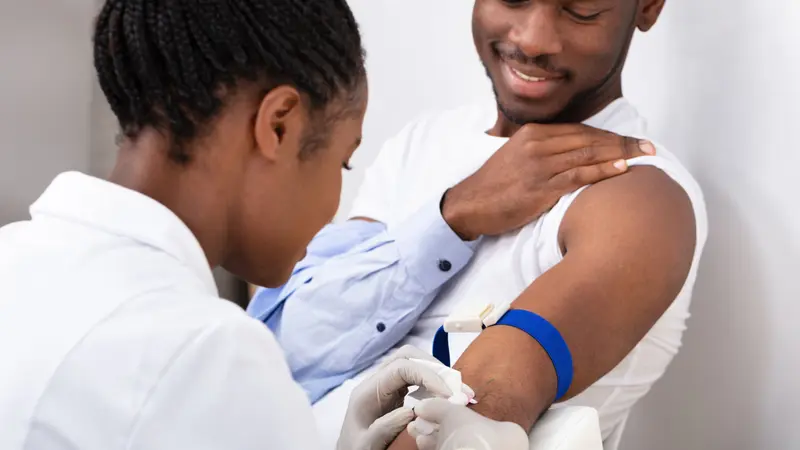 Close-up Of Female Doctor Collecting A Blood Sample