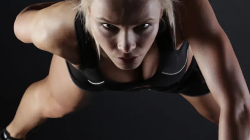 Woman doing one arm pushup Woman doing one arm pushup