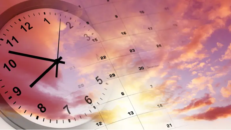 Clock and calendar in bright sky