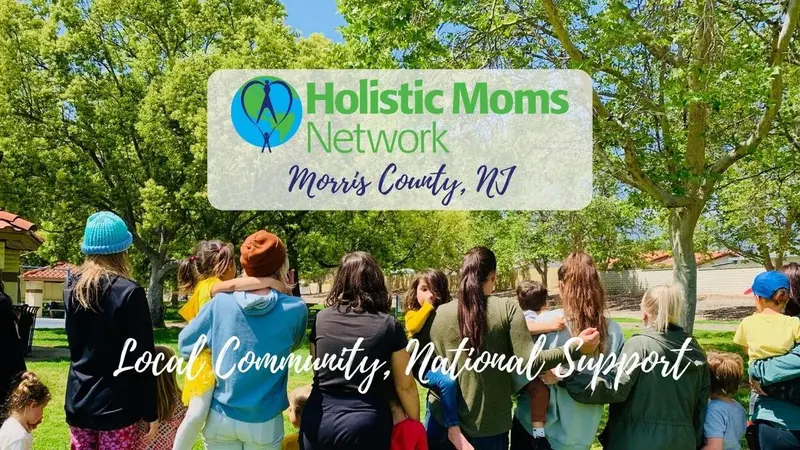 Green Trees at the top, with women standing in a line holding their babies. Title of Chapter: Holistic Moms Network Morris County, NJ Chapter. Local Community, National Support