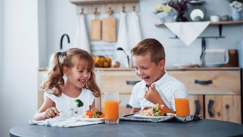 Kids enjoying a healthy meal Kids enjoying a healthy meal