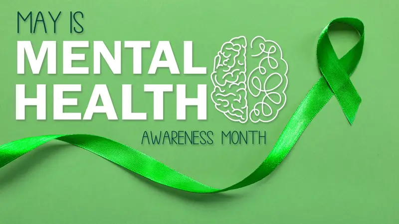 Green ribbon and text MAY IS MENTAL HEALTH AWARENESS MONTH