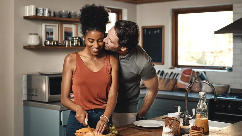 Couple kissing in the kitchen