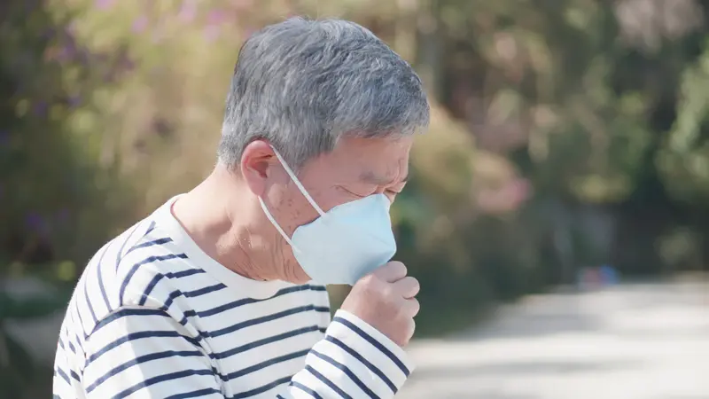 Asian old man coughs and wear protective mask Asian old man coughs and wear protective mask