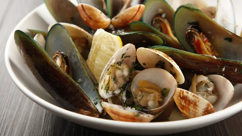 Assorted shellfish on a bowl. Assorted shellfish on a bowl.