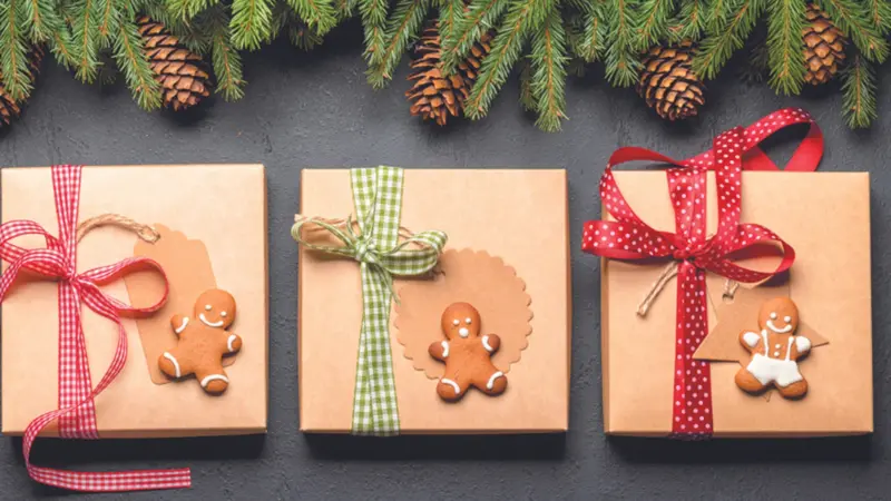 Fir tree branch, Christmas gift boxes laying flat Fir tree branch, Christmas gift boxes laying flat