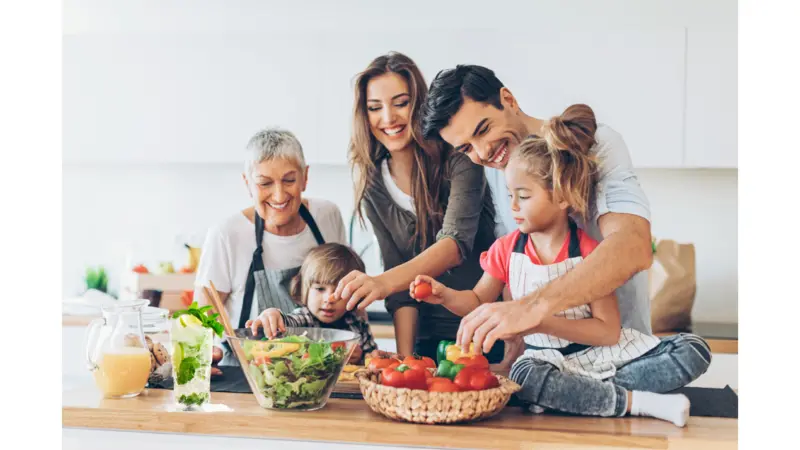 Family around food on the kitchen counter