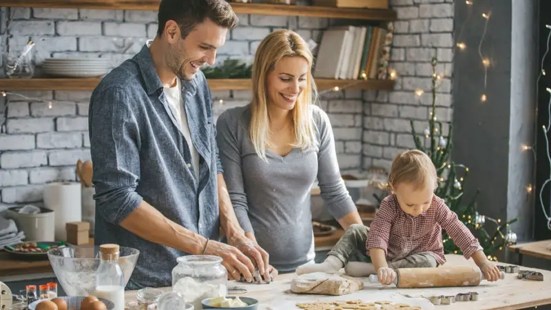 Family making holiday cookies