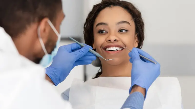 Woman receiving dental exam Woman receiving dental exam