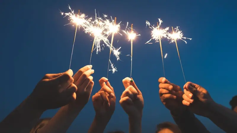 Hands holding sparklers Hands holding sparklers