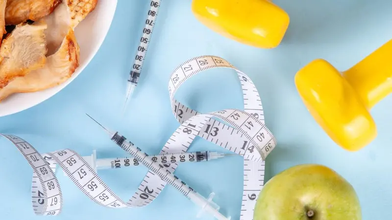 Vector for weight loss including syringes, weights and food Vector for weight loss including syringes, weights and food