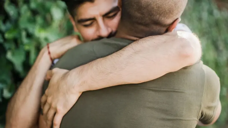 Two men hugging Two men hugging