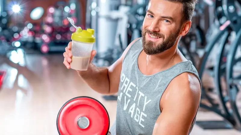 Man drinking post-workout protein shake Man drinking post-workout protein shake
