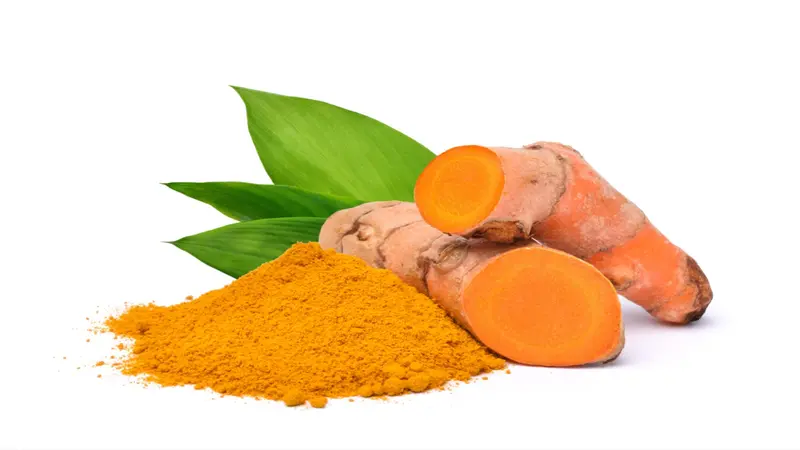 Turmeric (Curcuma longa Linn) rhizome (root) sliced with Finely dry powder and green leaves isolated on white background. Turmeric (Curcuma longa Linn) rhizome (root) sliced with Finely dry powder and green leaves isolated on white background.