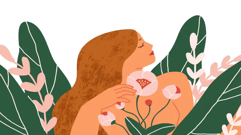 Happy peaceful blooming woman with blossomed flowers around.