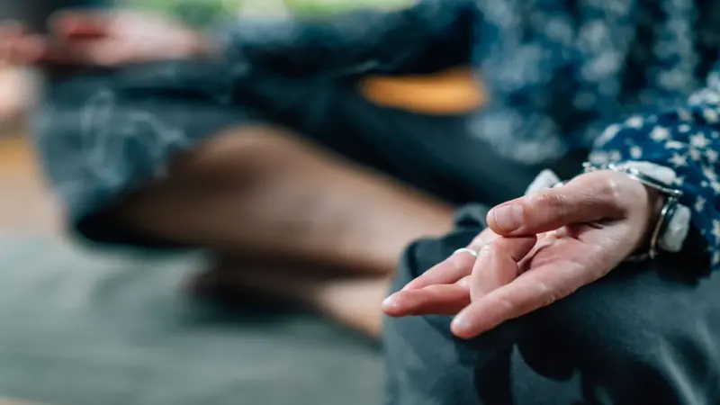close-up of person practicing mudras