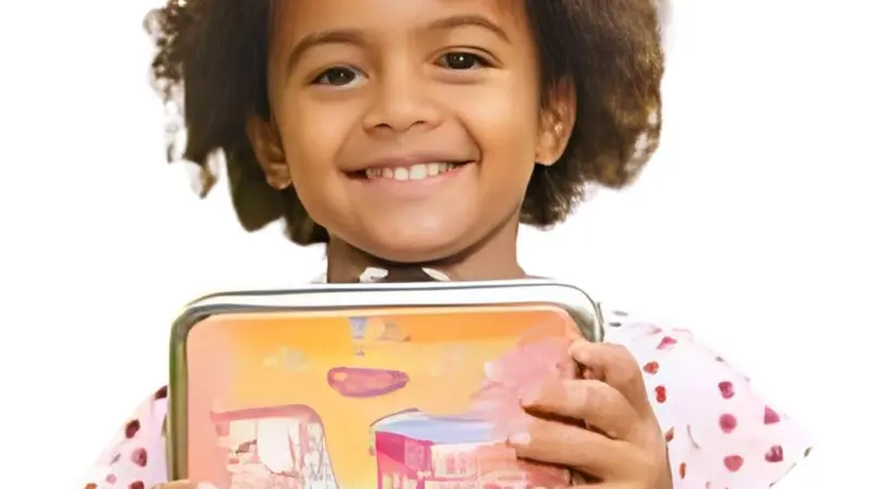 Girl holding her lunch box Girl holding her lunch box
