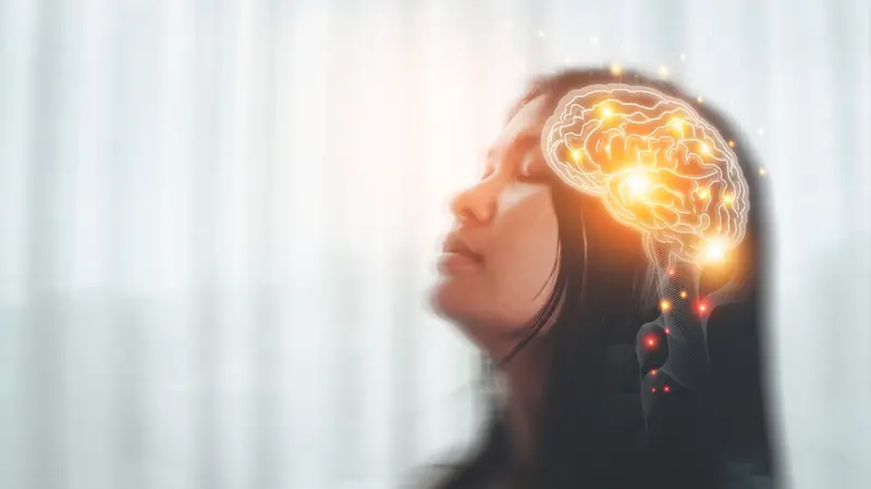 Concept are of a woman with nervous system in brain lighting up, illustrative of emerging polyvagal theory Concept are of a woman with nervous system in brain lighting up, illustrative of emerging polyvagal theory
