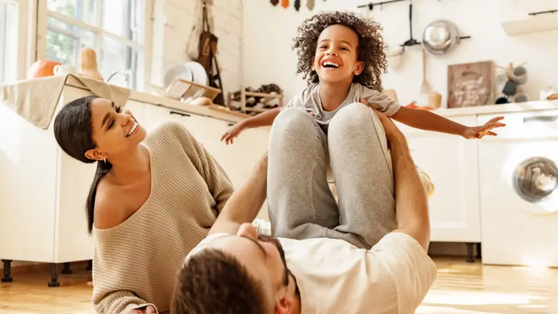 happy family playing together in house