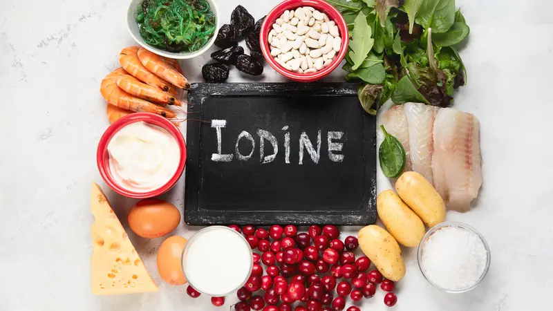 array of iodine-rich foods with chalkboard in center that says "Iodine"
