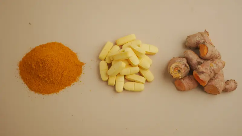 turmeric powder, supplement pills, and root