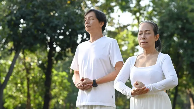 senior couple doing Qi Gong