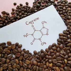 coffee beans and drawing of Caffeine molecule