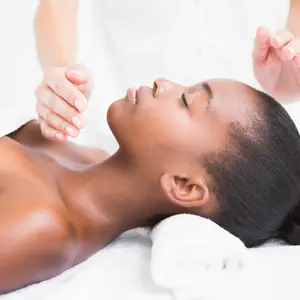 woman receiving Reiki Therapy