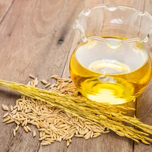 Rice bran oil in bottle glass and unmilled rice