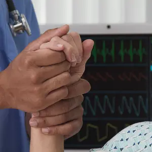 nurse doing Therapeutic Touch in patient