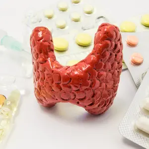 4d thyroid surrounded by pills and medicine vials