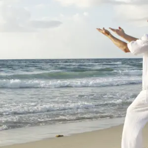 man tai chi on beach