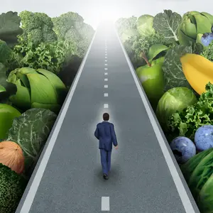 man on road past fruits and veggies