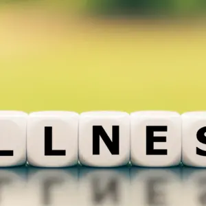 tiles spell out wellness or illness
