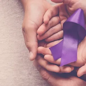 Brain sign in boy's head and Adult and child hands holding purple ribbon, Alzheimer's disease