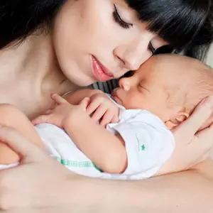 mother holding her newborn baby