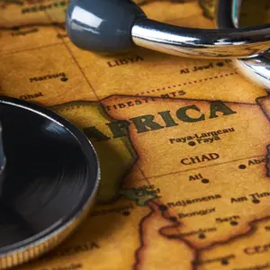 Medical stethoscope over Africa map