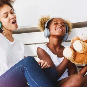 Girls having fun at home, listening music