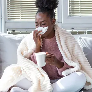 woman has runny nose and common cold