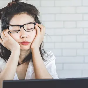 woman sleepy taking a nap at desk