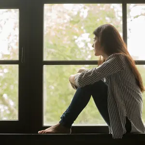 young pensive woman feeling lonely